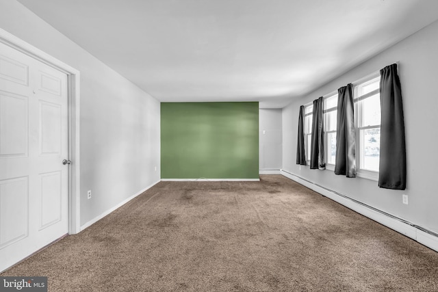 102 Sunset St, Browns Mills, NJ 08015 - carpeted empty room with baseboard heating and baseboards