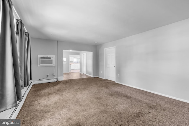 102 Sunset St, Browns Mills, NJ 08015 - carpeted spare room featuring baseboard heating, a wall unit AC, and baseboards