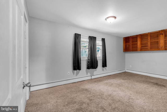 102 Sunset St, Browns Mills, NJ 08015 - spare room with carpet and a baseboard radiator