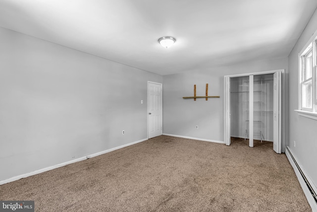102 Sunset St, Browns Mills, NJ 08015 - unfurnished bedroom featuring a baseboard radiator, carpet floors, baseboards, and a closet
