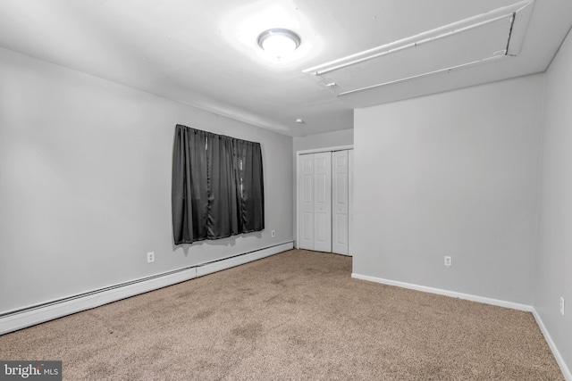 102 Sunset St, Browns Mills, NJ 08015 - unfurnished bedroom featuring attic access, a baseboard heating unit, carpet floors, a closet, and baseboards
