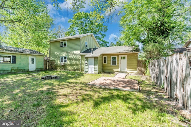102 Sunset St, Browns Mills, NJ 08015 - rear view of house featuring an outdoor fire pit, a patio area, and an outdoor structure