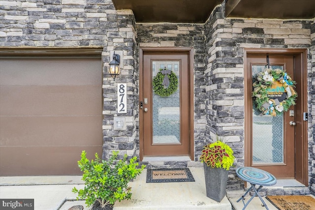 property entrance featuring stone siding