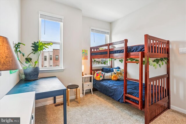bedroom with carpet flooring and baseboards