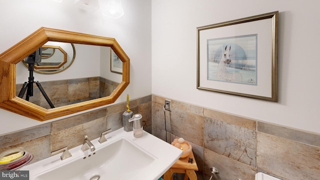 955 Lucabaugh Mill Rd, Westminster, MD 21157 - bathroom featuring a sink, tile walls, and tasteful backsplash