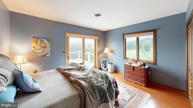 955 Lucabaugh Mill Rd, Westminster, MD 21157 - bedroom with access to outside, light wood-type flooring, and baseboards
