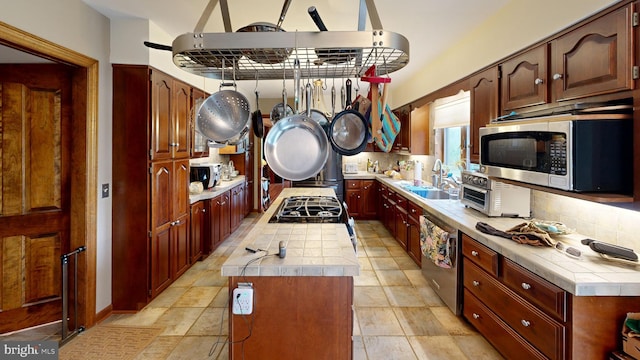 955 Lucabaugh Mill Rd, Westminster, MD 21157 - kitchen featuring stainless steel appliances, a sink, a center island, tile counters, and tasteful backsplash