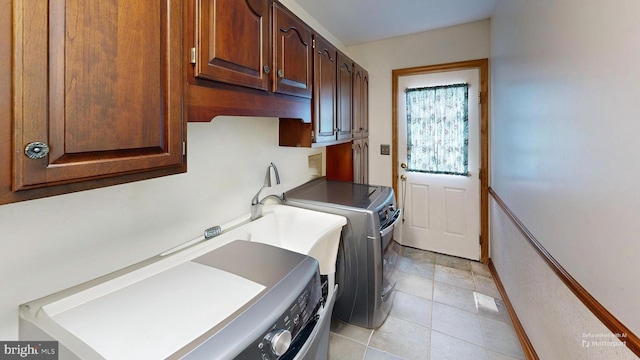 955 Lucabaugh Mill Rd, Westminster, MD 21157 - laundry room featuring washing machine and dryer, cabinet space, and light tile patterned floors