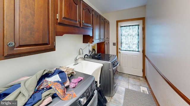 955 Lucabaugh Mill Rd, Westminster, MD 21157 - laundry room featuring washing machine and clothes dryer, cabinet space, and light stone finish flooring