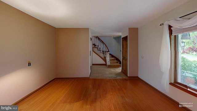 955 Lucabaugh Mill Rd, Westminster, MD 21157 - empty room featuring light wood finished floors, stairs, and baseboards