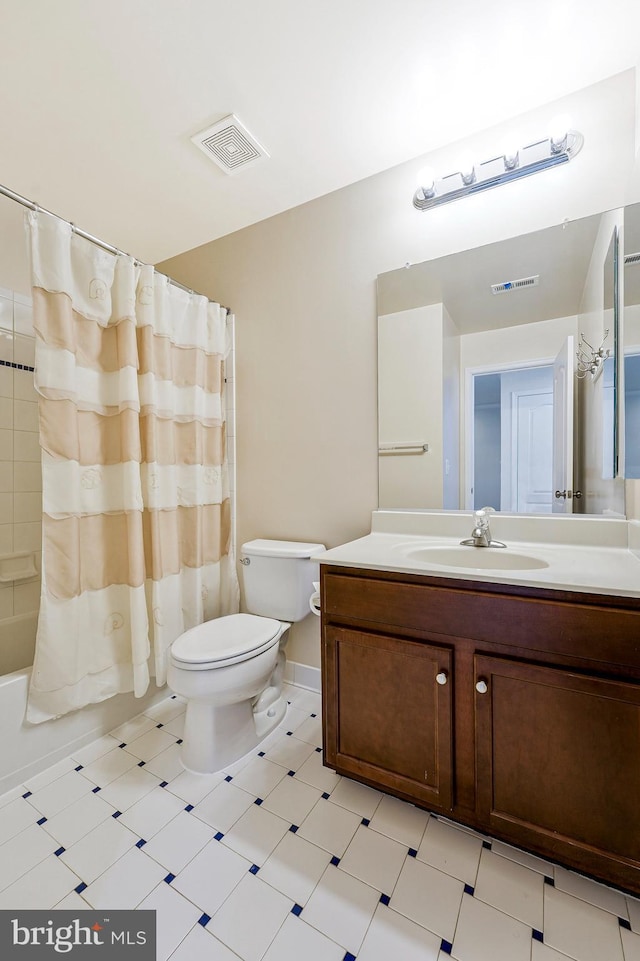 bathroom with toilet, vanity, tile patterned floors, and shower / tub combo with curtain