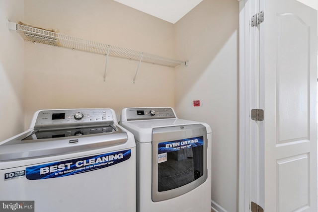 washroom with washing machine and dryer
