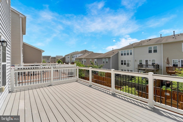 wooden deck featuring a residential view