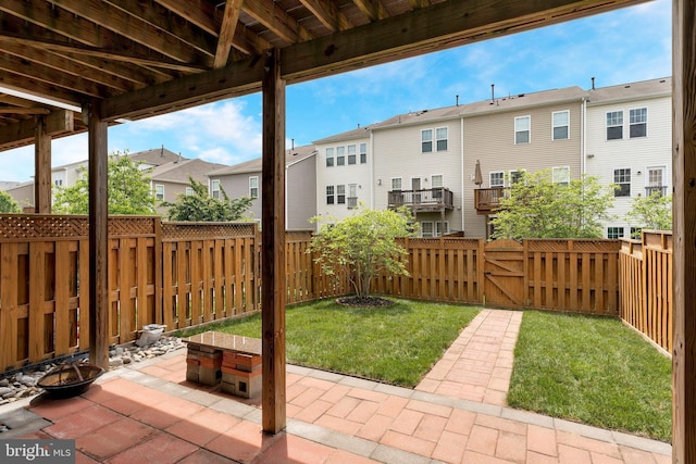 view of patio / terrace featuring a residential view and an outdoor fire pit