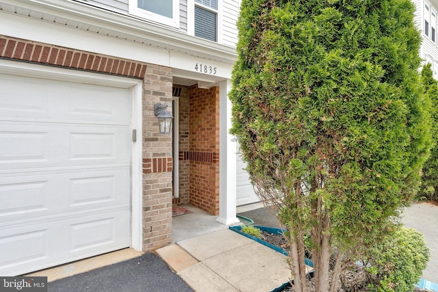 property entrance with brick siding