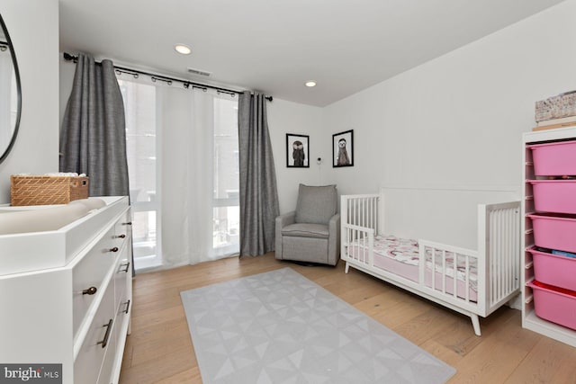 1716 Cambridge St Unit 3, Philadelphia, PA 19130 - bedroom featuring multiple windows, wood finished floors, recessed lighting, and a nursery area