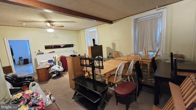 carpeted dining room featuring ceiling fan