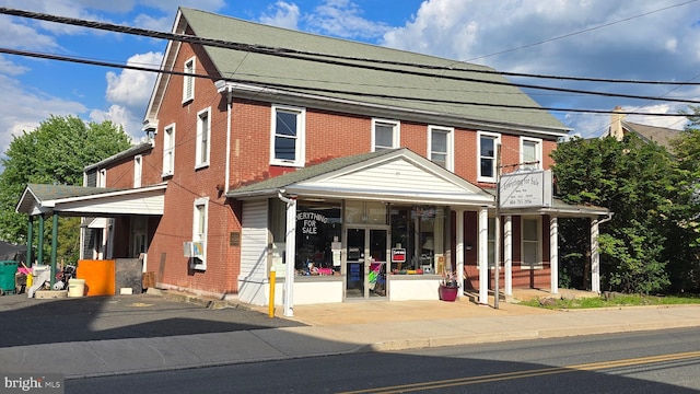 view of front of house featuring brick siding