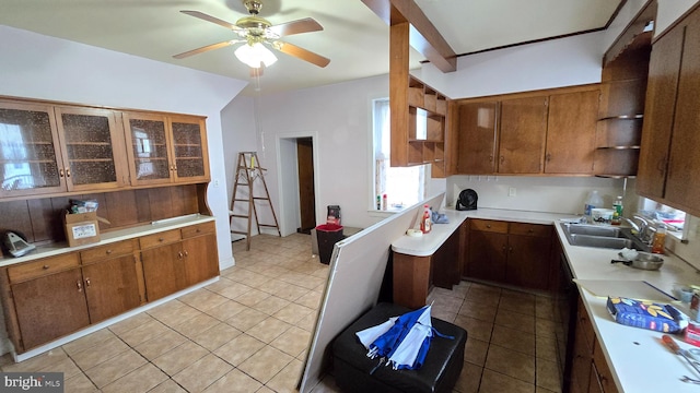 kitchen with open shelves, a sink, light countertops, ceiling fan, and light tile patterned flooring