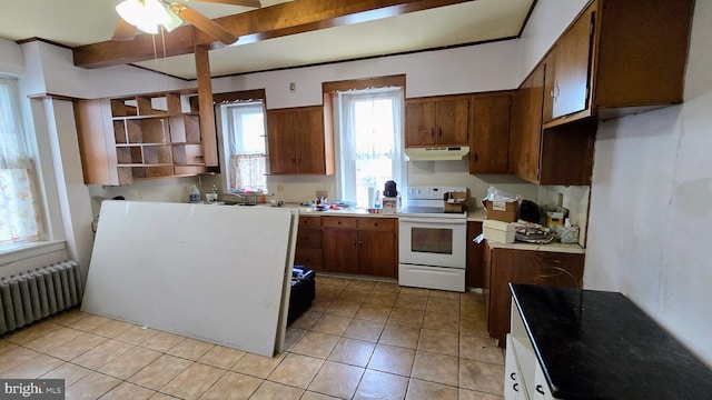 kitchen with white range with electric stovetop, radiator heating unit, under cabinet range hood, a ceiling fan, and light tile patterned floors