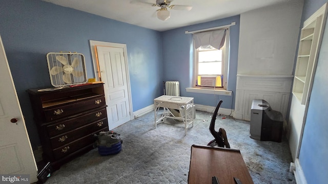 carpeted bedroom with radiator, baseboards, cooling unit, and a ceiling fan