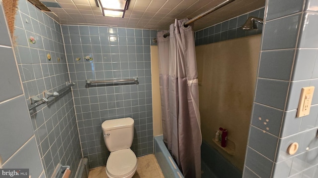 full bathroom featuring toilet, tile walls, and shower / tub combo with curtain