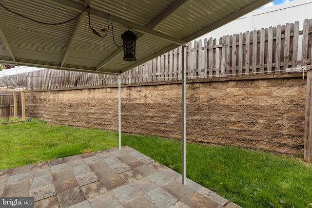 view of patio / terrace featuring a fenced backyard and ceiling fan