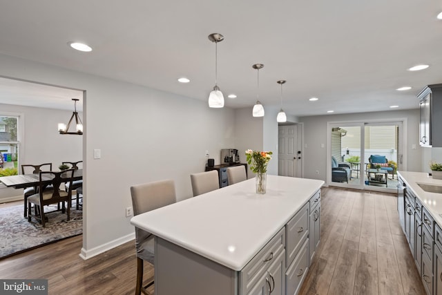6281 Hidden Clearing, Columbia, MD 21045 - kitchen with gray cabinetry, dark wood-style flooring, light countertops, a center island, and recessed lighting