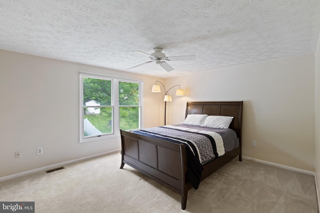 6281 Hidden Clearing, Columbia, MD 21045 - carpeted bedroom with baseboards, a textured ceiling, and a ceiling fan