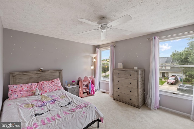 6281 Hidden Clearing, Columbia, MD 21045 - carpeted bedroom featuring a textured ceiling, a ceiling fan, and baseboards