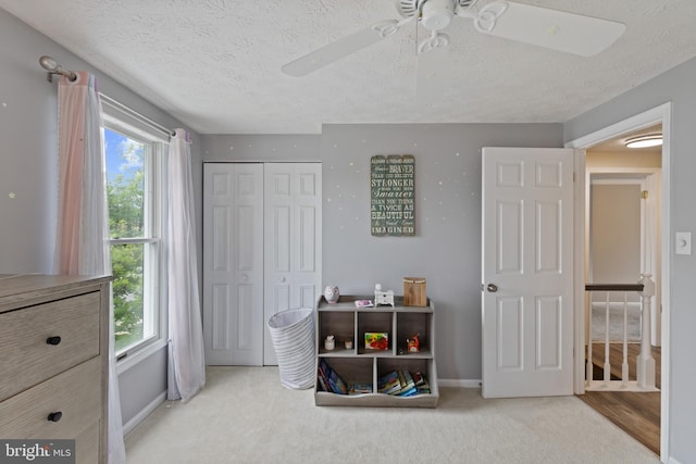 6281 Hidden Clearing, Columbia, MD 21045 - carpeted bedroom with a textured ceiling, a closet, baseboards, and ceiling fan