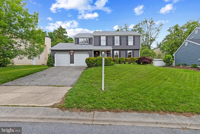 6281 Hidden Clearing, Columbia, MD 21045 - view of front of house with asphalt driveway, a garage, and a front yard