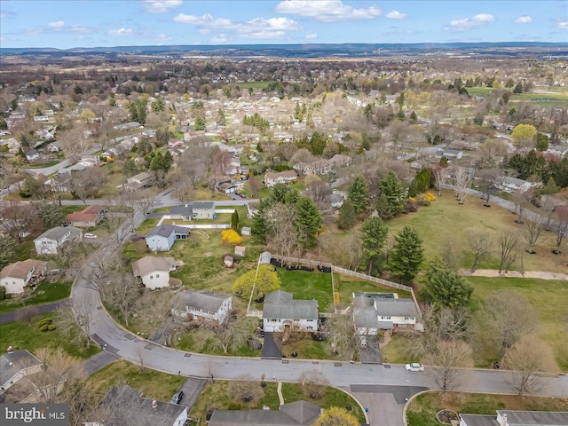 aerial overview of property's location with nearby suburban area