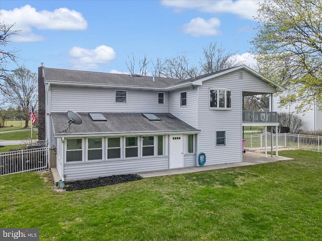 rear view of property with a patio, a shingled roof, and a balcony