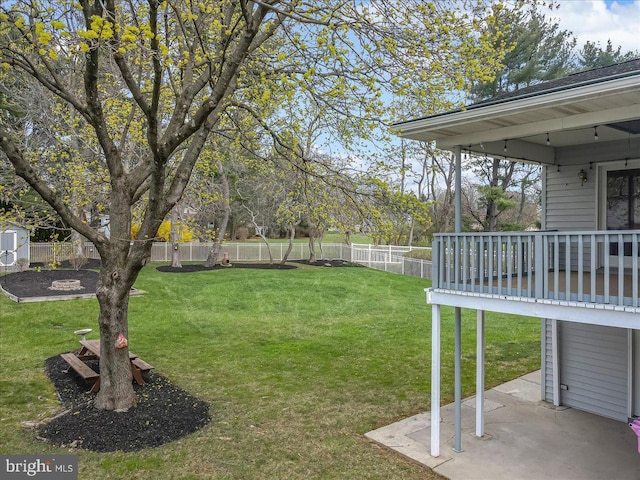 view of yard featuring a patio area and a shed