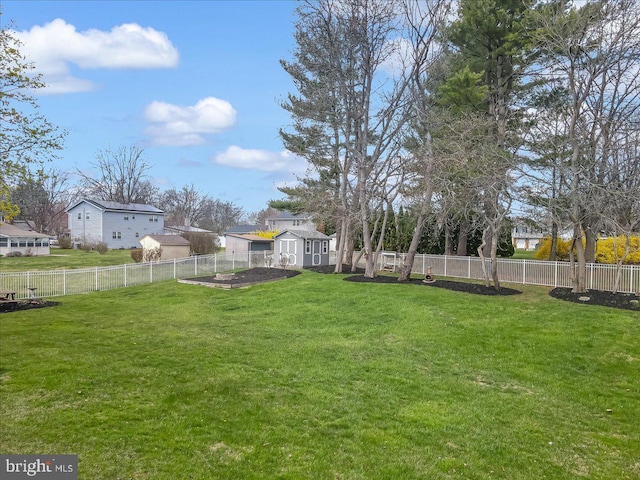 view of yard with a storage shed and an outdoor structure