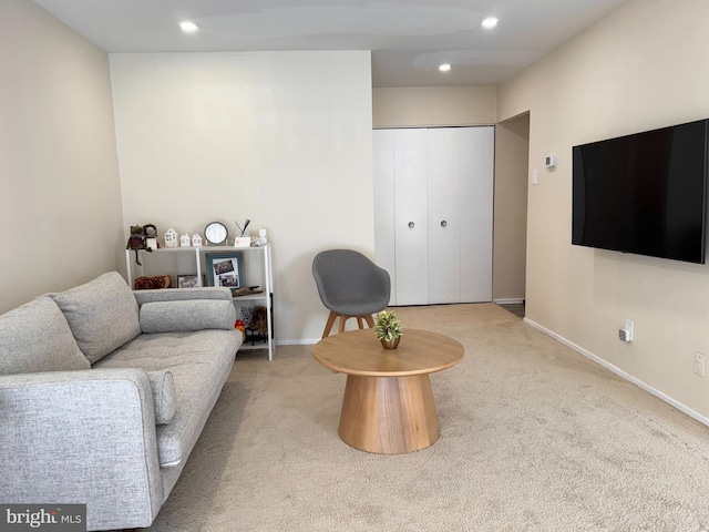 living room with carpet, recessed lighting, and baseboards