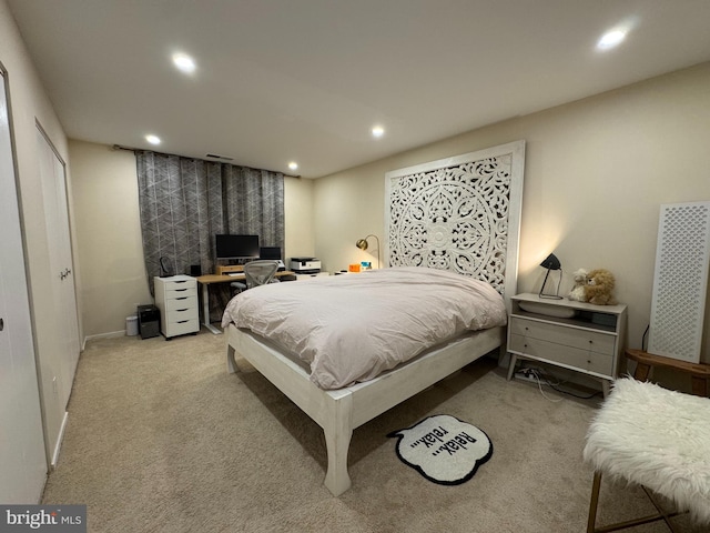 bedroom featuring recessed lighting, light carpet, and baseboards