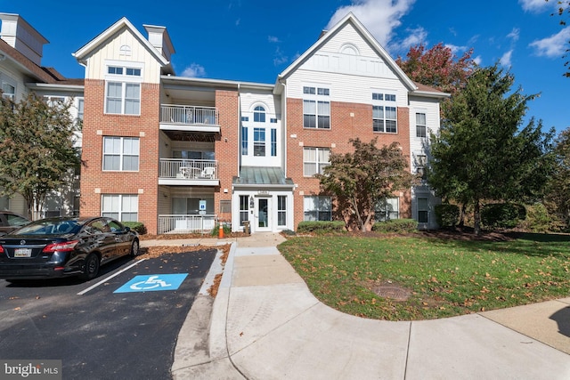 view of property featuring uncovered parking