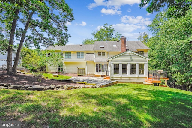 3415 Miller Heights Rd, Oakton, VA 22124 - rear view of property featuring a patio, a chimney, a lawn, and a wooden deck