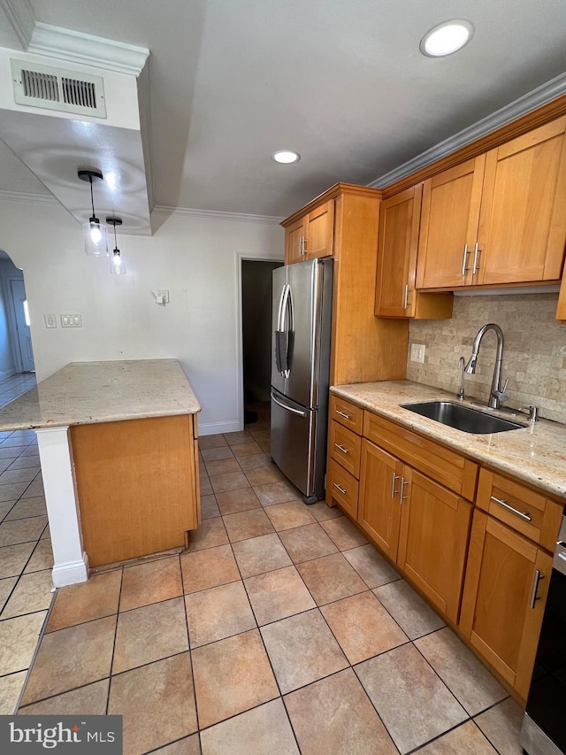 4126 I St, Philadelphia, PA 19124 - kitchen with freestanding refrigerator, a sink, tasteful backsplash, light tile patterned flooring, and ornamental molding