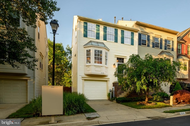multi unit property featuring concrete driveway