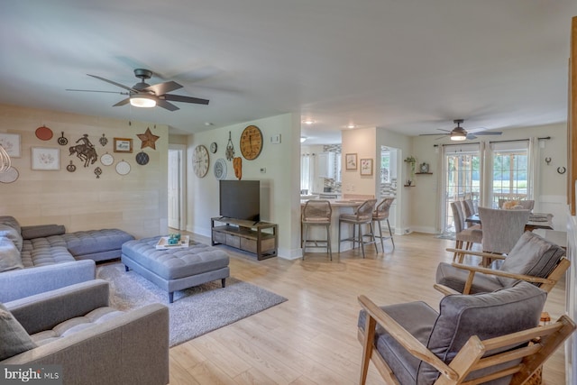 18418 Gravel Hill Rd, Georgetown, DE 19947 - living room featuring a ceiling fan, light wood-style floors, and baseboards