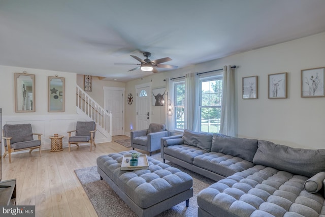 18418 Gravel Hill Rd, Georgetown, DE 19947 - living room with stairway, light wood-style flooring, and a ceiling fan