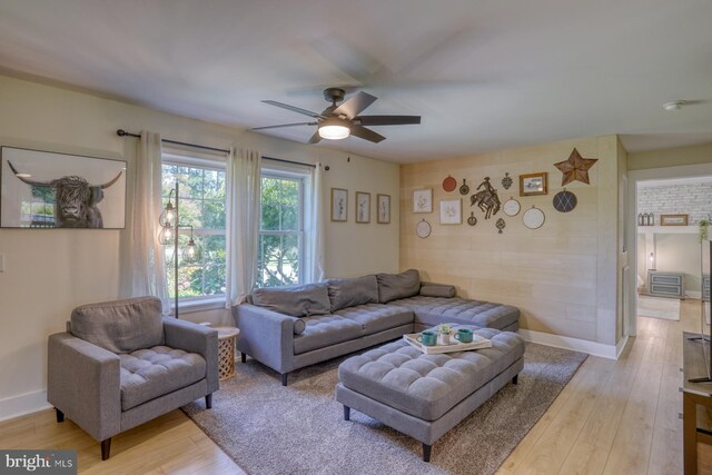 18418 Gravel Hill Rd, Georgetown, DE 19947 - living room featuring a ceiling fan, light wood-style floors, and baseboards