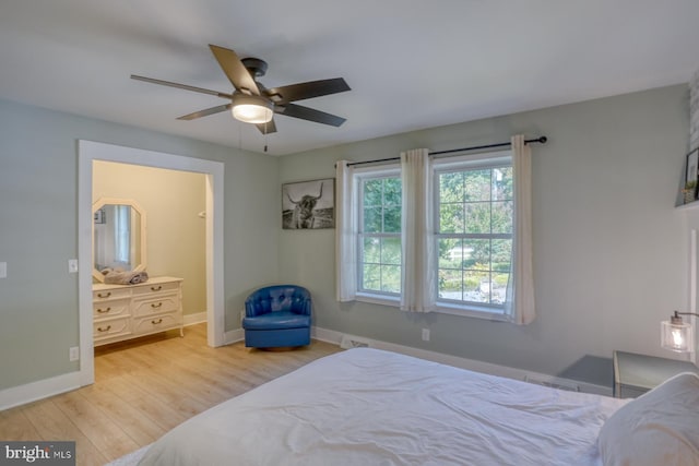 18418 Gravel Hill Rd, Georgetown, DE 19947 - bedroom with wood finished floors, baseboards, a ceiling fan, and connected bathroom