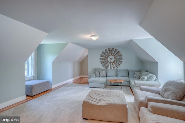 18418 Gravel Hill Rd, Georgetown, DE 19947 - living room with lofted ceiling, wood finished floors, and baseboards