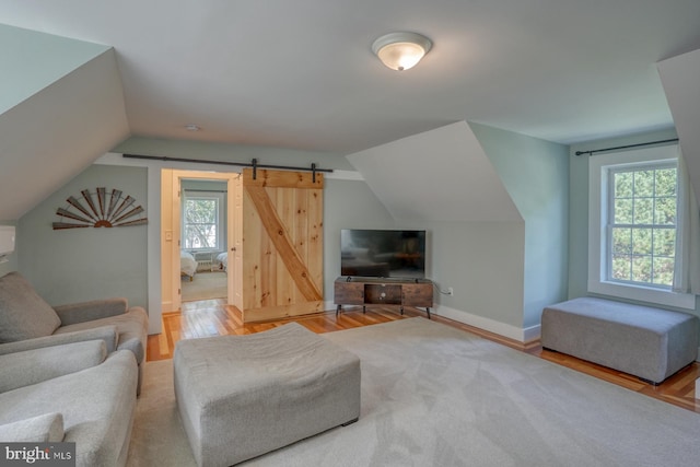 18418 Gravel Hill Rd, Georgetown, DE 19947 - living area featuring wood finished floors, vaulted ceiling, and baseboards