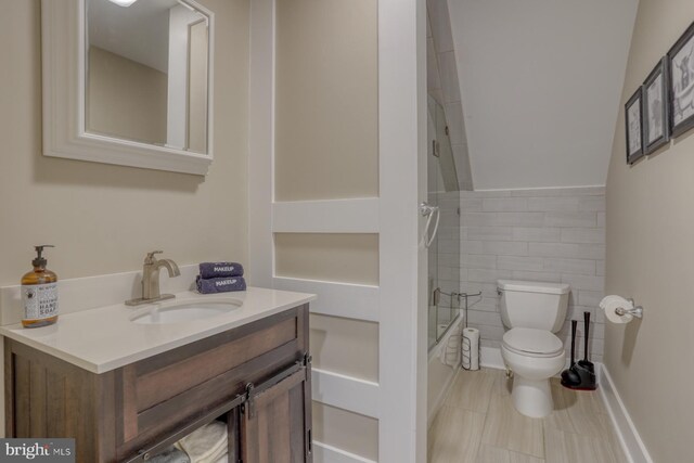 18418 Gravel Hill Rd, Georgetown, DE 19947 - full bath with toilet, vanity, tile walls, shower / bath combination, and tile patterned floors