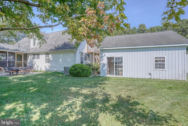 18418 Gravel Hill Rd, Georgetown, DE 19947 - rear view of property with a yard, a shingled roof, and a patio